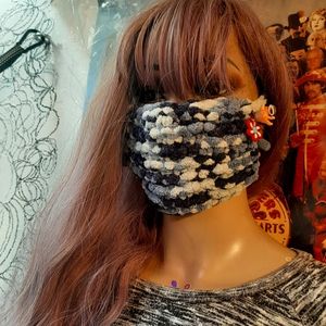 Knitted mask with adjustable strings